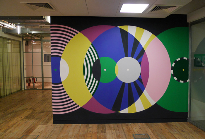 Corridor wall painted with large concentric rings