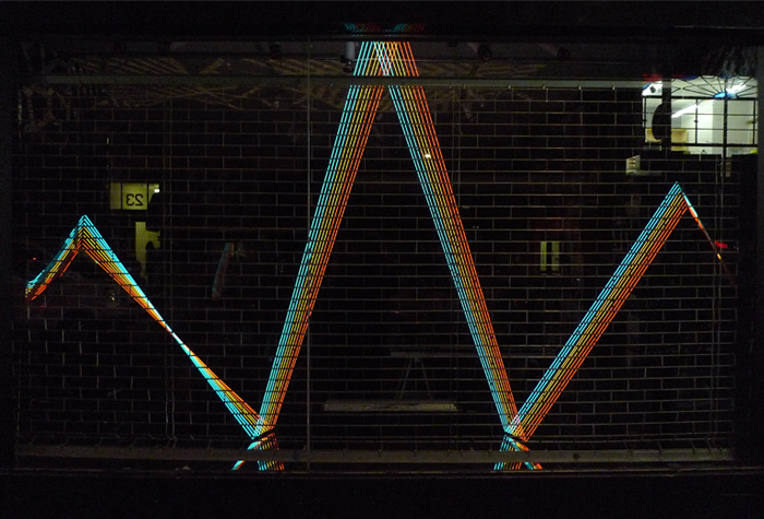 Zigzag lines of light in a dark room