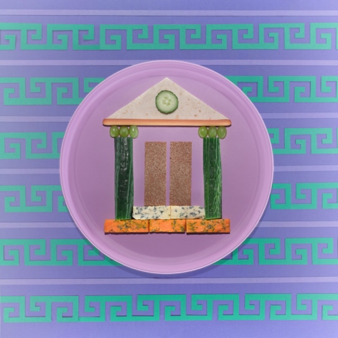 Illustrated plate with a temple facade on a Greek-key background