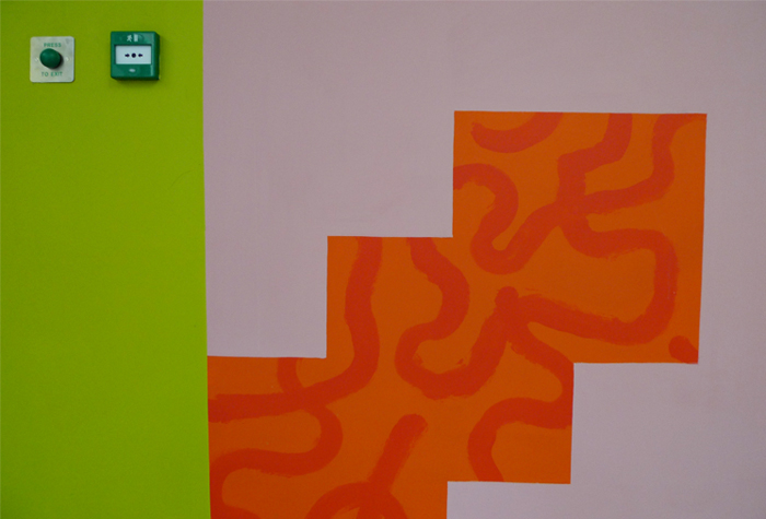 Orange stepped shape on lime green