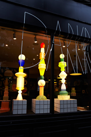 Coloured totem lights lit in a dark room